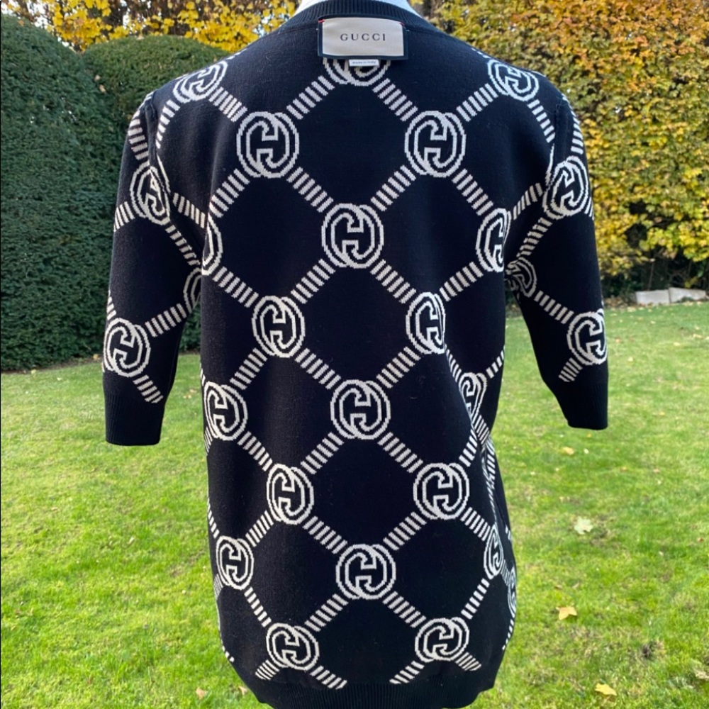 Beautiful Gucci reversible sweater brand new.  Too small on me why I'm selling!